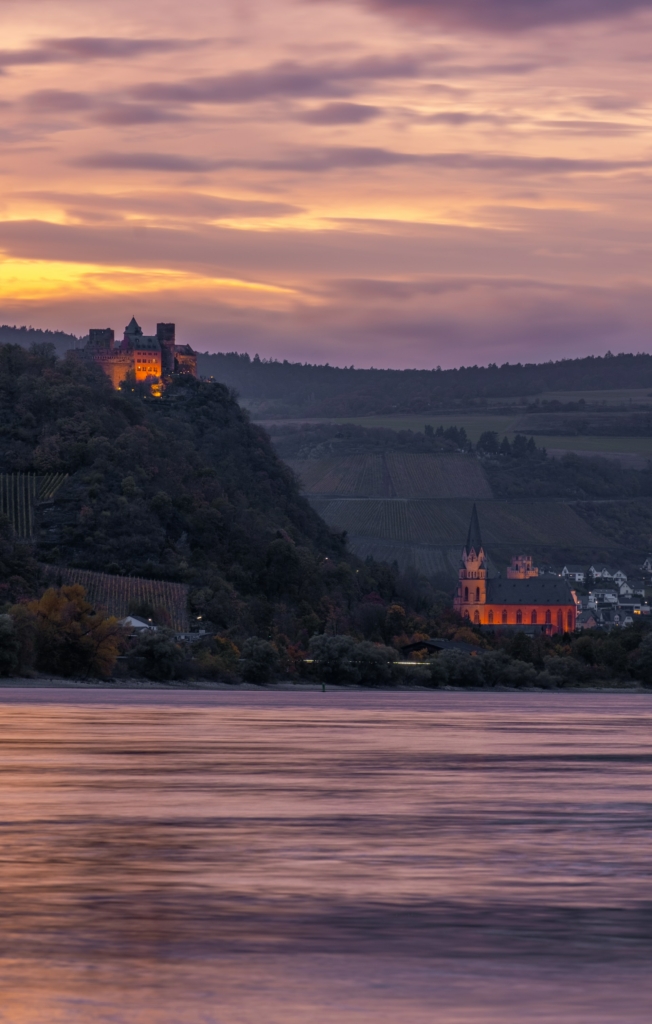 A picture of Schönburg Castle in the Rhine Valley at sunset.